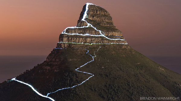 Lion's Head hikers descending after sunset.